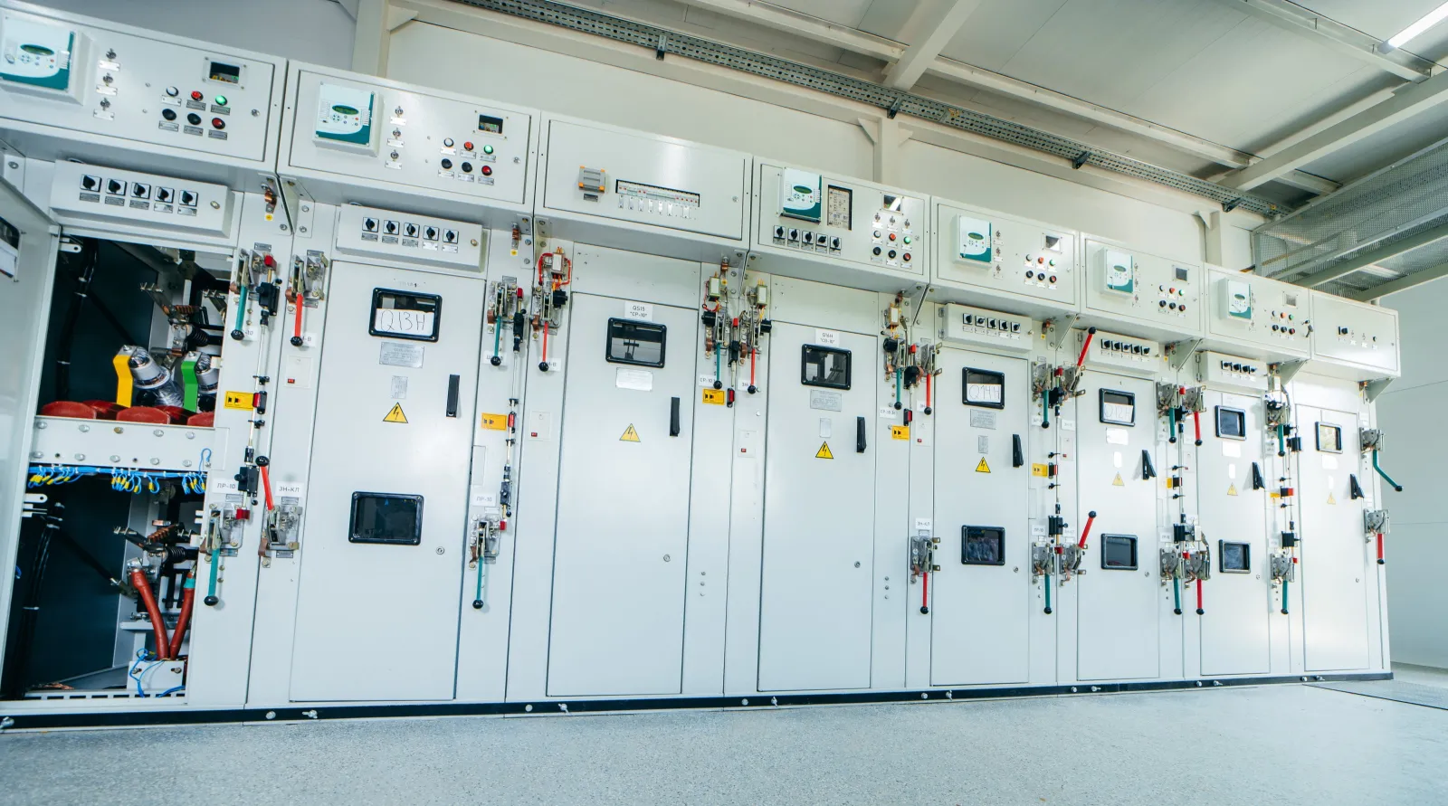 Row of electrical switchgear panels