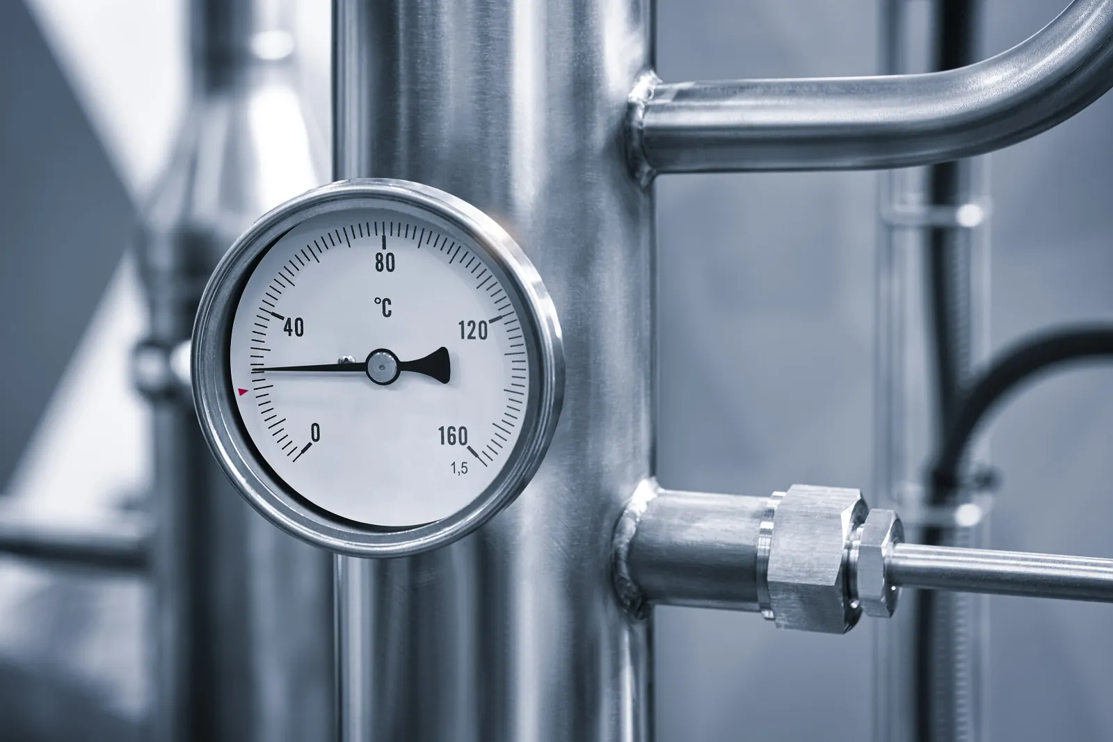 Temperature gauge on stainless steel pipework